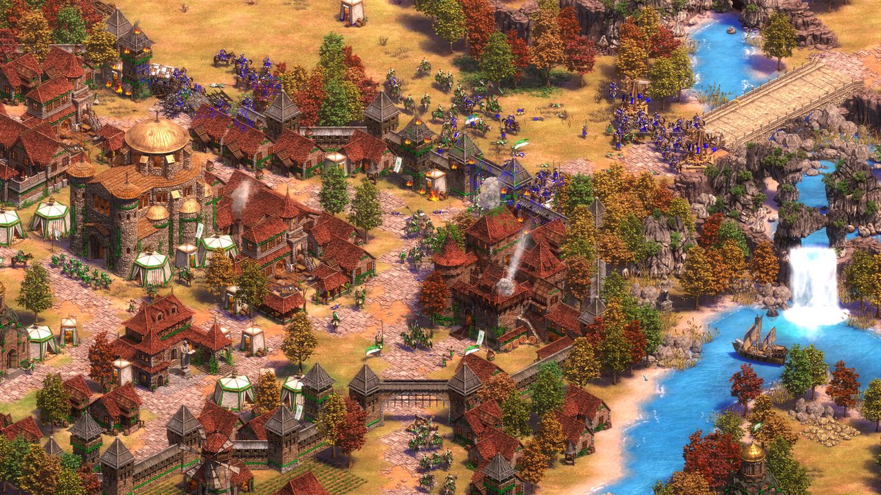 A riverside town with a waterfall