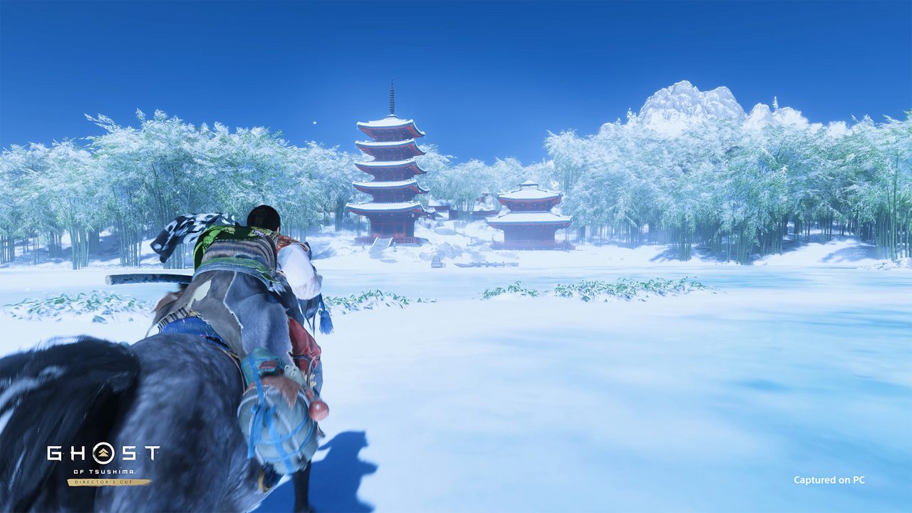 Riding through snow towards a pagoda
