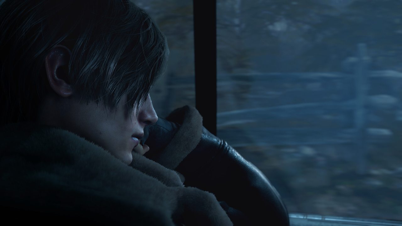 Leon looking out of a car window at a snowy forest